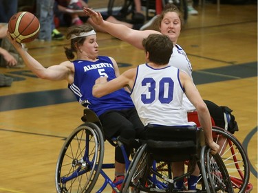 BEST PHOTO - Alberta Black's Ben Moronchuk (#5) competes against Alberta Blue in the gold medal game at the 2016 Junior West Regional Wheelchair Basketball Championship at Walter Murray Collegiate on May 1, 2016.