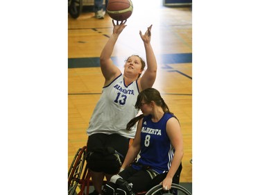 Alberta Blue's Arinn Young (#13) competes against Alberta Black's Jamie Cole during the gold medal game at the 2016 Junior West Regional Wheelchair Basketball Championship at Walter Murray Collegiate on May 1, 2016.