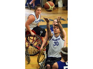 Alberta Blue's Branden Troutman (#30) takes a shot against Alberta Black in the gold medal game at the 2016 Junior West Regional Wheelchair Basketball Championship at Walter Murray Collegiate on May 1, 2016.