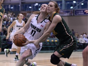 Huskies guard Laura Dally (11) has been invited to Canada’s national women’s basketball team camp