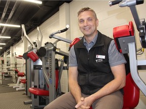 Dean Dodge, Chief Executive Officer of the Saskatoon YMCA, sits on a piece of exercising equipment at the YMCA's location in downtown Saskatoon. He says the organization is getting ready to rally volunteers in preparation of a fundraising campaign for a potentially multi-million renovation at its downtown location. (Morgan Modjeski/The Saskatoon StarPhoenix)