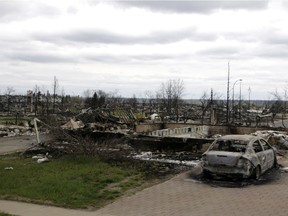 Destroyed property in Fort McMurray, Alberta, is viewed Monday, May 9, 2016. A break in the weather has officials optimistic they have reached a turning point on getting a handle on the massive wildfire.