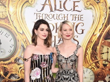 Actors Anne Hathaway (L) and Mia Wasikowska attend Disney's "Alice Through the Looking Glass" premiere at the El Capitan Theatre on May 23, 2016 in Hollywood, California.