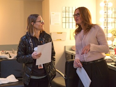 Julia Roberts and director Jodie Foster (L) on the set of TriStar Pictures' "Money Monster."