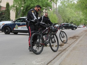 Saskatoon Police Service bike unit officers helped a family of ducks navigate their way through downtown.