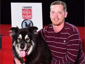 Mitch Hawman poses with his heroic dog, Rex, who saved Hawman's mother from a house fire north of Aberdeen on Christmas Eve. Rex was inducted into the 2016 Purina Animal Hall of Fame in Toronto Tuesday.