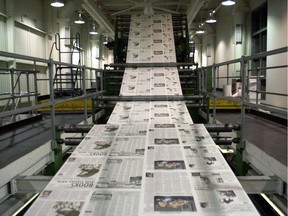 Newspapers are printed on a Transcontinental press in Quebec. The company announced Monday that it had sold 13 Saskatchewan papers and will be closing its Saskatoon printing plant.