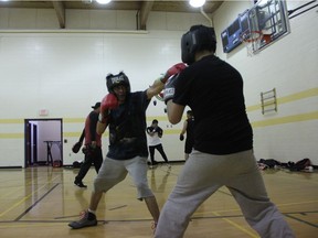 Owen Swiftwolfe extends a quick left jab toward an opponent during training exercises at the Chief Taylor Elementary School gym located on the Onion Lake Cree Nation. He is one of roughly 25 fighters who are set to compete in an upcoming tournament called Rise of Warriors on May 28, 2016.