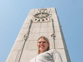 Pamela Brotzel, urban planner and leader of the "Jane's Walk" Downtown Trivia walking tour, stands in front of the Cenotaph clock at City Hall Plaza in Saskatoon. The clock is an item of trivia in her walking tour, which includes facts about Saskatoon's downtown district. The tour is scheduled for 2 p.m. May 7 and starts at the corner of 23rd and Spadina.