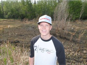 Prince Albert Police Service Cst. Luke Torgunrud stands near the site where he pulled an immobile man from a grass fire. (Tyler Clarke/Prince Albert Daily Herald)