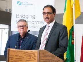 Ralph Goodale, federal minister of public safety, looks on as Amarjeet Sohi, federal minister of infrastructure and communities, speaks about the federal government's contribution to the upcoming interchange project at Boychuk Drive and highway 16 during a press conference on May 26, 2016.