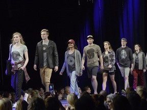 Models wearing designs by the Regina clothing company Tentree walk the runway at Saskatchewan Fashion Week on Thursday night.