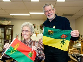 Saskatchewan flag designers Anthony Drake, right, and Imelda Burgart met for the first time at St. Angela Merici Residence in Saskatoon on May 26, 2016.