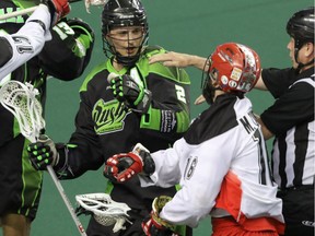 Brett Mydske of the Rush disagrees with Calgary's Mike Carnegie during Saturday's playoff opener.