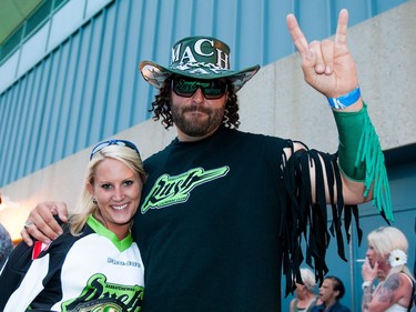 Saskatchewan Rush fans Leon Precesky (right) and Jennifer Limacher (left) say that the team unites the province and offers them an opportunity to party with 15,000 of their closest friends.