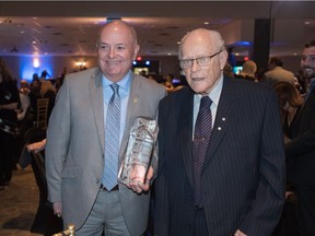 Former University of Saskatchewan professor Charles "Red" Williams (on the right, with Phil Klein of the Royal Bank) was inducted into the SABEX Hall of Fame on  May 19, 2016.