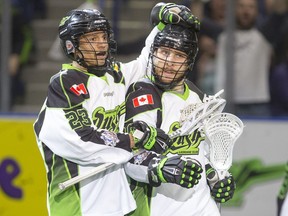 Ben McIntosh, right, is congratulated after scoring against the Colorado Mammoth recently.