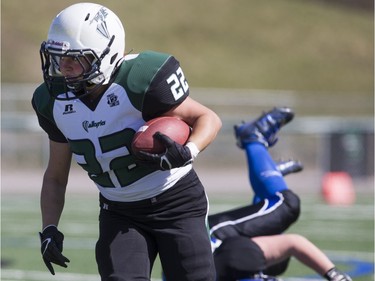 Saskatoon Valkyries running back Samantha Matheson moves the ball against the Edmonton Storm during a Western Women's Canadian Football League (WWCFL) exhibition game at SMF field on Saturday, April 30, 2016