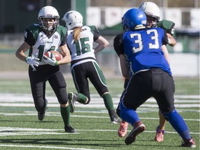 SASKATOON, SASK--APRIL 27 2016 0502 Sports Valkyries- Saskatoon Valkyries running back Julene Friesen moves the ball against the Edmonton Storm during a Western Women's Canadian Football League (WWCFL) exhibition game at SMF field on Saturday, April 30, 2016. (Liam Richards/Saskatoon StarPhoenix)  Program and Website for Storm roster incomplete