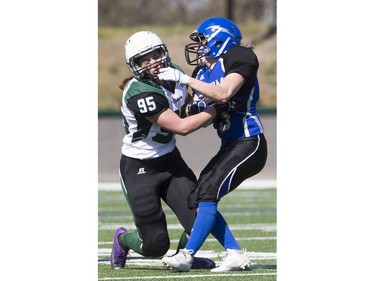 Saskatoon Valkyries defensive linemen Danielle Haughian tackles Edmonton Storm player Brenna Bouchard during a Western Women's Canadian Football League (WWCFL) exhibition game at SMF field on Saturday, April 30, 2016