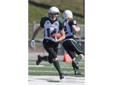 Saskatoon Valkyries running back Julene Friesen moves the ball against the Edmonton Storm during a Western Women's Canadian Football League (WWCFL) exhibition game at SMF field on Saturday, April 30, 2016