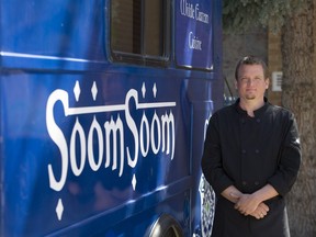 Caley Dallin, operator of Soom Soom food truck, stands for a photo with his food truck on Saturday, April 30, 2016.