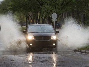 An afternoon rainfall created large puddles for cars on Friday in Saskatoon.