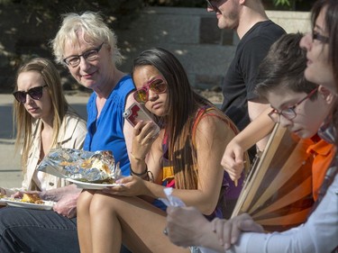 A well attended festival atmosphere at City Hall's Civic Square, where refugees and the Open Door Society took on the task of raising money for Fort McMurray with a game of cricket on 23rd Street East, May 16, 2016. Ethnic foods, song, music and art were part of the festivities.