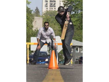 A well attended festival atmosphere at City Hall's Civic Square, where refugees and the Open Door Society took on the task of raising money for Fort McMurray with a game of cricket on 23rd Street East, May 16, 2016. Ethnic foods, song, music and art were part of the festivities.