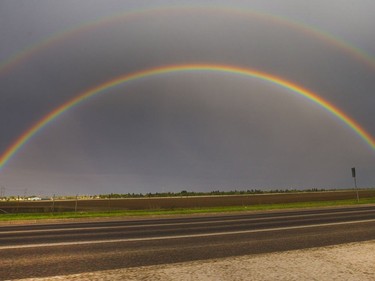 A magnificent rainbow jumped out of the dark eastern rain cloudy sky near the University of Saskatchewan grounds, May 17, 2016.