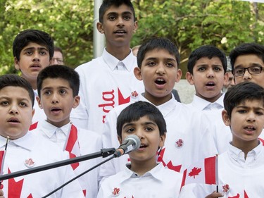 Children sing O' Canada at the Ahmadiyya Muslim Jama`at Canada celebration of 50 years of successfully integrating into Canada in Civic Square in Saskatoon, May 18, 2016. National President of the Ahmadiyya Muslim Jama`at, Mr. Lal Khan Malik, received a proclamation from Mayor Don Atchison proclaiming Ahmadiyya Muslim Day at the ceremony.