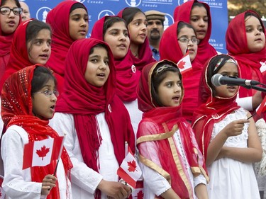 Children sing O' Canada at the Ahmadiyya Muslim Jama`at Canada celebration of 50 years of successfully integrating into Canada in Civic Square in Saskatoon, May 18, 2016. National President of the Ahmadiyya Muslim Jama`at, Mr. Lal Khan Malik, received a proclamation from Mayor Don Atchison proclaiming Ahmadiyya Muslim Day at the ceremony.