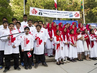 Children sing O' Canada at the Ahmadiyya Muslim Jama`at Canada celebration of 50 years of successfully integrating into Canada in Civic Square in Saskatoon, May 18, 2016. National President of the Ahmadiyya Muslim Jama`at, Mr. Lal Khan Malik, received a proclamation from Mayor Don Atchison proclaiming Ahmadiyya Muslim Day at the ceremony.