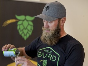 PGA Tour golfer Graham DeLaet pours a glass of Prairie Baard — Blue Collar craft, the new craft beer he is endorsing.