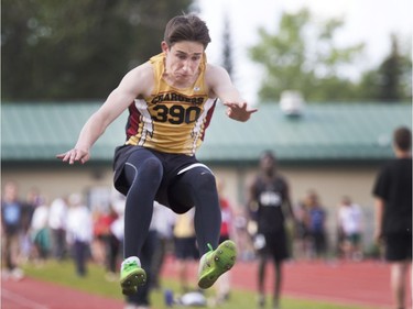 A Centennial Chargers takes charge in long jump at the Saskatoon High School Track and Field city championships at Griffith Stadium, May 25, 2016.