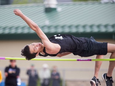 Ben Fisher of St. Joseph high school in high jump at the Saskatoon High School Track and Field city championships at Griffith Stadium, May 25, 2016.