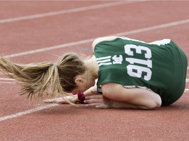 Ensley Fendelet feeling sick, falls at the finish line in the midget girls 400-metre heat at the Saskatoon High School Track and Field city championships at Griffith Stadium, May 25, 2016.