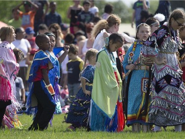 A sunny day enhances the beauty and colour bringing many cultures together at the 24th annual Mount Royal Collegiate Powwow, May 26, 2016.