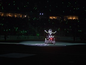 Bruiser, the Rush mascot, is surrounded by glow sticks before Saturday's playoff game against Calgary.
