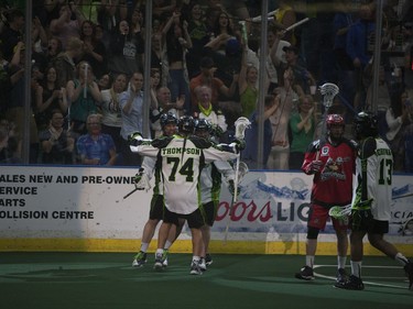 The Saskatchewan Rush celebrate after scoring a goal during their game against the Calgary Roughnecks at SaskTel Centre in Saskatoon, May 21, 2016.