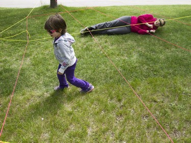 Louise Baker (L) and her mother Erika Baker play at the Pop-up Playground in Victoria Park, May 28, 2016. This playground is to help children focus on the natural work in Saskatoon.