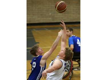 BC Storm's Tanner Scott competes competes against Alberta White's Brandon Doll in the bronze medal game during the 2016 Junior West Regional Wheelchair Basketball Championship at Walter Murray Collegiate on May 1, 2016.