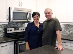 Wendy and Eugene Wawryk stand in the basement suite of the house they built in Evergreen.