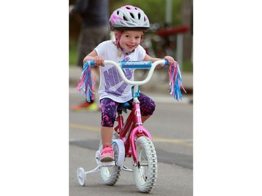 A young cyclists races at Bikes on Broadway in downtown Saskatoon on May 22, 2016.