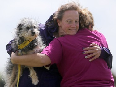 Koralee Samaroden and her dog Rizzo give hugs before heading back to Fort McMurray at the dog agility show in Saskatoon on May 22, 2016.