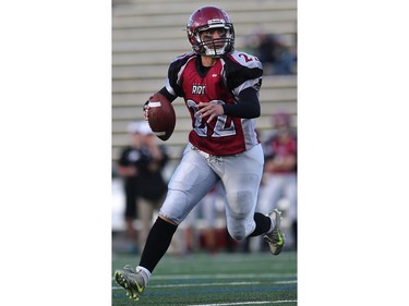 Regina Riot's Aimee Kowalski eyes up her pass during women's tackle football action at SMF Field in Saskatoon on May 22, 2016.