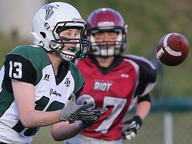 Saskatoon Valkyries' Alyssa Wiebe makes the catch during women's tackle football action at SMF Field in Saskatoon on May 22, 2016.