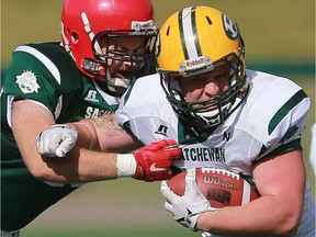 North's Ben Abrook holds onto the ball during 12-Man Ed Henick Senior Bowl action at SMF Field in Saskatoon on May 23, 2016. (Michelle Berg / Saskatoon StarPhoenix)