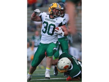 North's Ben Abrook holds onto the ball during 12 Man Ed Henick Senior Bowl action at SMF Field in Saskatoon on May 23, 2016.