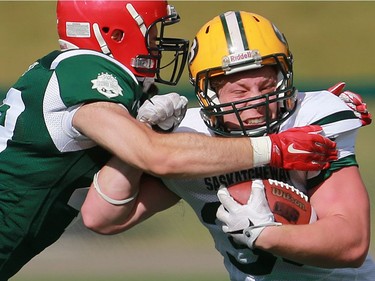 North's Ben Abrook holds onto the ball during 12 Man Ed Henick Senior Bowl action at SMF Field in Saskatoon on May 23, 2016.